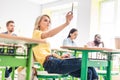 concentrated young students sitting in classroom Royalty Free Stock Photo
