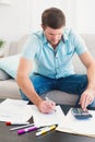 Concentrating man counting his bills Royalty Free Stock Photo