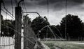 Concentration camp fence. Barbed wire net and electric fencing. Genocide, holocaust, world war, concentration camp themed design Royalty Free Stock Photo