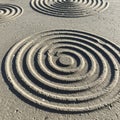 Concentric circles create a pattern on a flat, sandy surface. The grooves are evenly Royalty Free Stock Photo