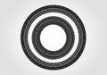 Concentric circles form a symmetrical pattern of black tire tracks against a white Royalty Free Stock Photo