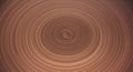 Concentric circular patterns in shades of brown and tan create a hypnotic, swirling Royalty Free Stock Photo