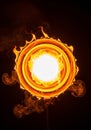Concentric rings of fire with a bright white core are set against a Royalty Free Stock Photo