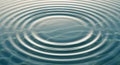 Concentric ripples spread outward on a Royalty Free Stock Photo