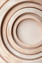 Concentric wooden planks create a captivating radial pattern, showcasing natural textures and harmonious lines. This Royalty Free Stock Photo