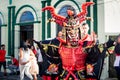 Closeup man in bright samurai warrior costume poses for photo at dominican carnival