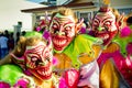 Closeup three men in scary clowns costumes pose for photo at dominican carnival