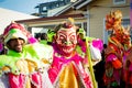 Group of men in scary clowns costumes poses for photo at dominican carnival