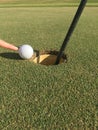 Golf Ball On Edge of Hole Royalty Free Stock Photo