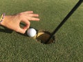 Golf Ball On Edge of Hole