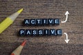 Concept of active and passive income words arranged with on wooden letter blocks Royalty Free Stock Photo