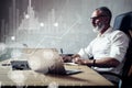 Concept of adult bearded businessman searching a great business solutions in modern workplace.Screen global virtual icon Royalty Free Stock Photo