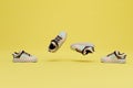 the concept of advertising sneakers for sale. sneakers flying across the yellow background. 3D render