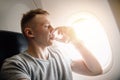 Concept aerophobia. Afraid of fear flying on an airplane and at height. drink water Royalty Free Stock Photo