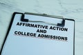 Concept of Affirmative Action and College Admissions write on paperwork isolated on wooden background