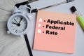 Concept of AFR - Applicable Federal Rate write on sticky notes isolated on Wooden Table Royalty Free Stock Photo