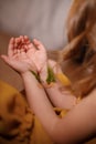 Concept against vaccination, depression, suicide, close-up of hands of a little girl with fern sprigs pasted with plasters on Royalty Free Stock Photo