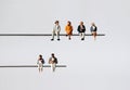 The concept of an aging society and low birthrate. Miniature people.