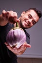 Big beautiful eggplant in man`s hands. Healthy lifestyle.