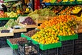 Concept of agriculture and farmers` products - the street trade of seasonal fruits - mandarins, persimmons, grapes, apples.