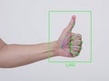 Concept of AI Hand tracking and gesture recognition. Accurately identifying a thumbs up sign as a like