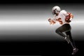 Concept american football, american football player with ball in hand. Black white background, copy space. American Royalty Free Stock Photo