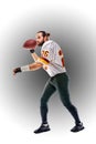 Concept american football, american football player with ball in hand. Black white background, copy space. American Royalty Free Stock Photo