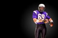 Concept american football, portrait of american football player in helmet with patriotic look. Black white background Royalty Free Stock Photo