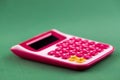 The concept of analysis, analytics, calculations. The calculator lies isolated on green bacground Royalty Free Stock Photo