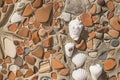 Concept of ancient culture Close up photo of broken colored stones and seashell with mosaic background .Pattern of