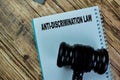 Concept of Anti-Discrimnation Law write on book isolated on Wooden Table Royalty Free Stock Photo