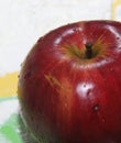 The concept of an Apple as an ingredient for making a filling for baking. The fruit of red color lies on the color boards studded