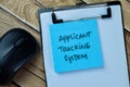 Concept of Applicant Tracking System write on sticky notes isolated on Wooden Table Royalty Free Stock Photo