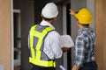 Concept architects or engineer holding pen pointing equipment architects on the desk with a blueprint in the office Royalty Free Stock Photo