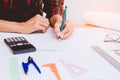 Concept architects,engineer holding pen pointing equipment architects On the desk with a blueprint in the office Royalty Free Stock Photo