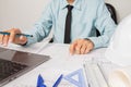 Concept architects, equipment architects ,Working On laptop with a blueprint and Model in the office Selective Focus Royalty Free Stock Photo