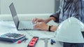 Concept architects, equipment architects ,Working On laptop with a blueprint and Model in the office soft focus ,Selective Focus Royalty Free Stock Photo