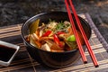 Concept of Asian cuisine. Thai soup Tom yam of chicken broth and coconut milk, mushrooms, chicken, chilli peppers, and vegetables Royalty Free Stock Photo