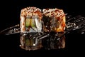 Concept of Asian cuisine. Two rolls of sushi with different fillings on a black background with the age for a Japanese menu