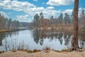 The concept of autumn meditative landscapes. Pond in the autumn forest. Natural beauty of the environment. Royalty Free Stock Photo