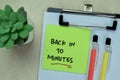 Concept of Back in 10 Minutes write on sticky notes isolated on Wooden Table