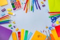 The concept of back to school. Colorful school supplies lie in the form of a frame on a gray-blue background. Books Royalty Free Stock Photo