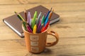 Cup full of markers and colored pencils Royalty Free Stock Photo