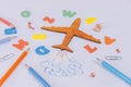 Concept Back to School. Flight of knowledge with airplane and colored letters on the background Royalty Free Stock Photo