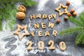 The concept 2020. Baked letters Happy New year and numbers 2020.Greeting card with gingerbread Royalty Free Stock Photo