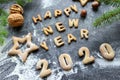 The concept 2020. Baked letters Happy New year and numbers 2020.Greeting card with gingerbread Royalty Free Stock Photo