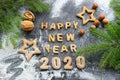 The concept 2020. Baked letters Happy New year and numbers 2020.Greeting card with gingerbread Royalty Free Stock Photo