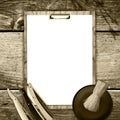 Concept of Barber Shop. Set of hairdressing tools and blank white sheet for text on a wooden background. Copy space. Toned, Sepia Royalty Free Stock Photo