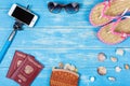 The concept of a beach holiday. Beach accessories lying on a blue background Royalty Free Stock Photo