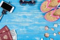 The concept of a beach holiday. Beach accessories lying on a blue wooden background. Royalty Free Stock Photo